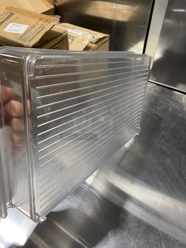 Commercial clear polycarbonate stackable container, pristine condition, ribbed design for stability, 7X capacity marker visible.