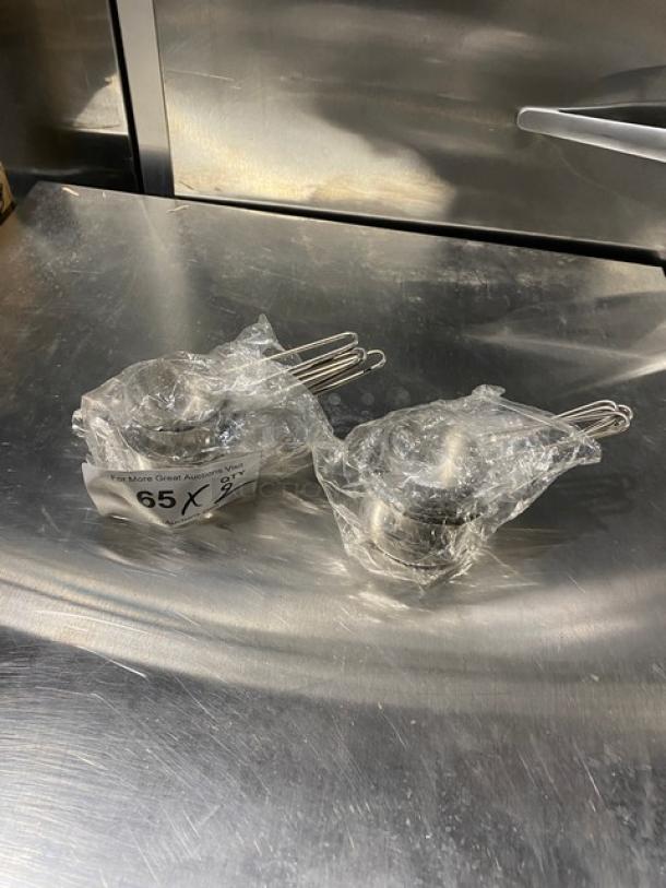 Commercial stainless steel measuring cup set, new in packaging, multiples included.