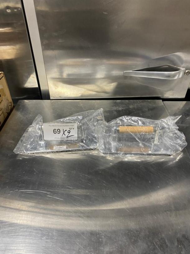 Brand new Vollrath Model 47709 cast aluminum steak weight, waffle-patterned, with wooden handle, in packaging.