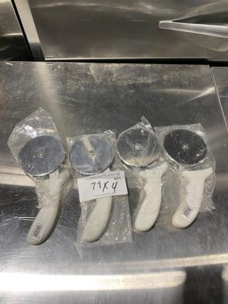 Brand new Dexter Russell Sani-Safe 4" pizza cutters, model PCP-4, with white grip handles. Pack of four.