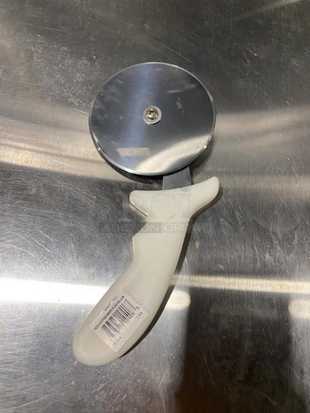 Brand new Dexter Russell Sani-Safe 4" pizza cutter, Model PCP-4, with white grip handle. Stainless steel blade.