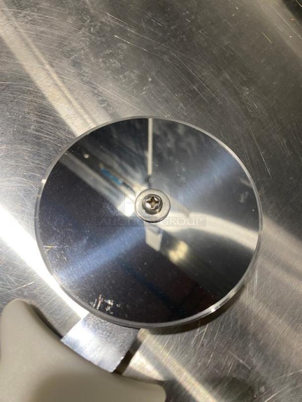 Dexter Russell Sani-Safe Series 4" stainless steel pizza cutter, model PCP-4, with white grip handle, brand new condition.