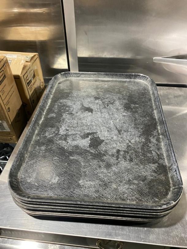 Commercial black rectangular fast food tray stack. Good condition, textured surface, ideal for serving. Size: 10X bid quantity.