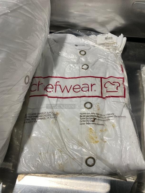 Brand new Chefwear commercial white XL chef top, model CW5664CW40, in packaging. Visible label with care instructions.