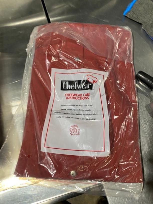 Brand new Chefwear red bar shirt, polyester/cotton blend, size 3X, Model 1310. Packaged with care instructions.