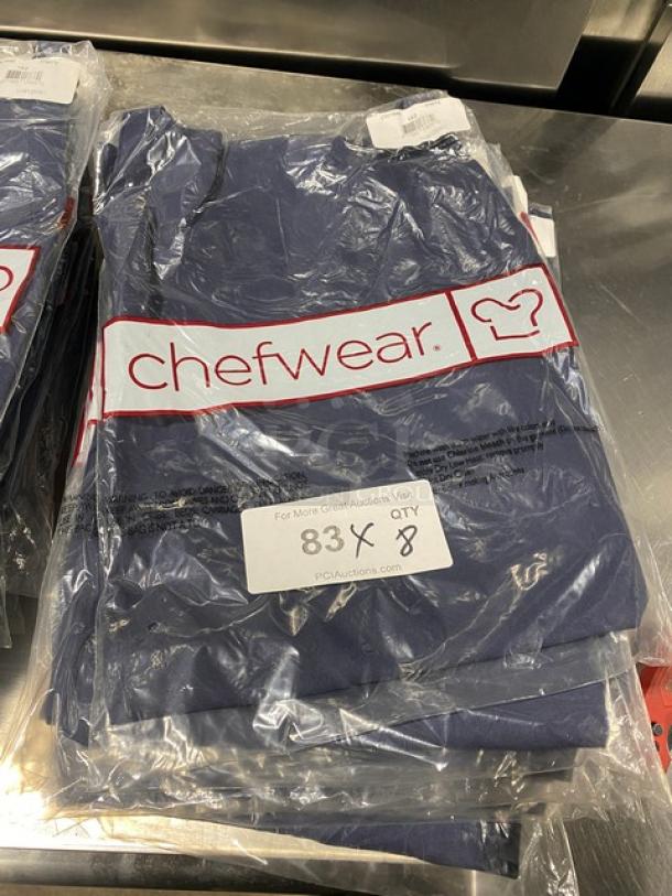 Brand new Chefwear navy-blue 2-pocket chef apron, model CW1648CW73, sealed in packaging, tagged for auction sale.