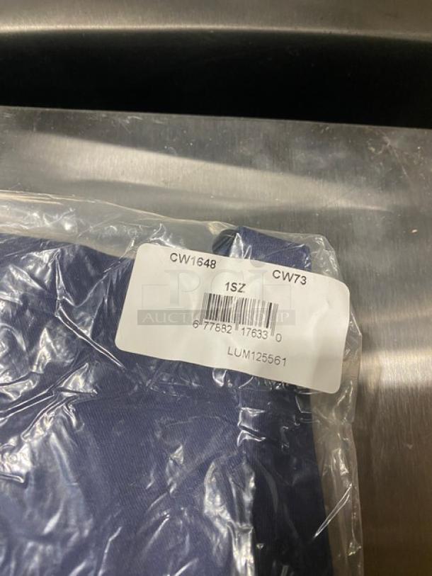 Brand new Chefwear navy-blue chef apron, model CW1648CW73, with two pockets. One size fits all.