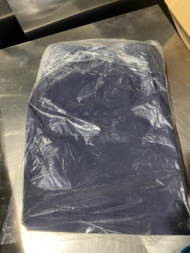 Brand new Chefwear navy-blue chef apron, model CW1648-CW73, with 2 pockets, sealed in plastic.