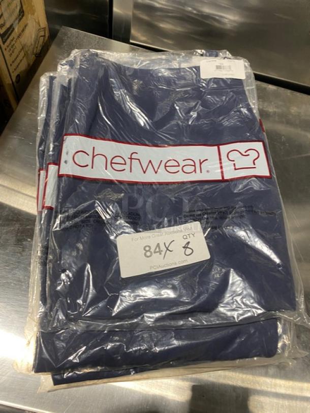 Brand new Chefwear navy-blue chef apron, model CW1648-CW73, one size, 2-pocket, in packaging with branding and auction label.