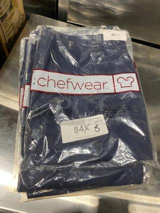 Brand new Chefwear navy-blue chef apron, model CW1648-CW73, one size, 2-pocket, in packaging with branding and auction label.