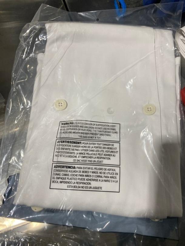 Brand new Chef Revival LJ027S white chef jacket, polyester/cotton blend, ladies small, in packaging with warning label.