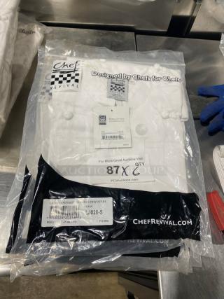 Brand new Chef Revival LJ028-S ladies chef jacket, white polyester/cotton blend, cloth knot buttons, size S, sealed packaging.