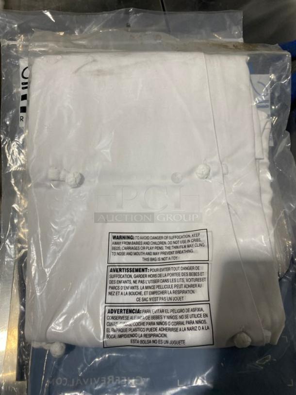 Brand new Chef Revival LJ028-S chef jacket in white, size small. Polyester/cotton blend with cloth knot buttons. Sealed in packaging.