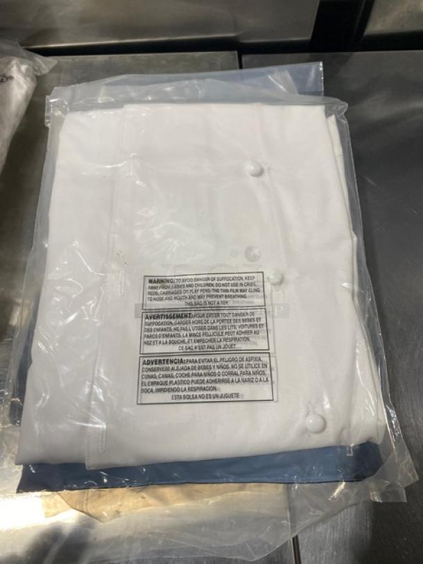 Brand new Chef Revival J023S white chef jacket, size S, with push-thru buttons, in original packaging.