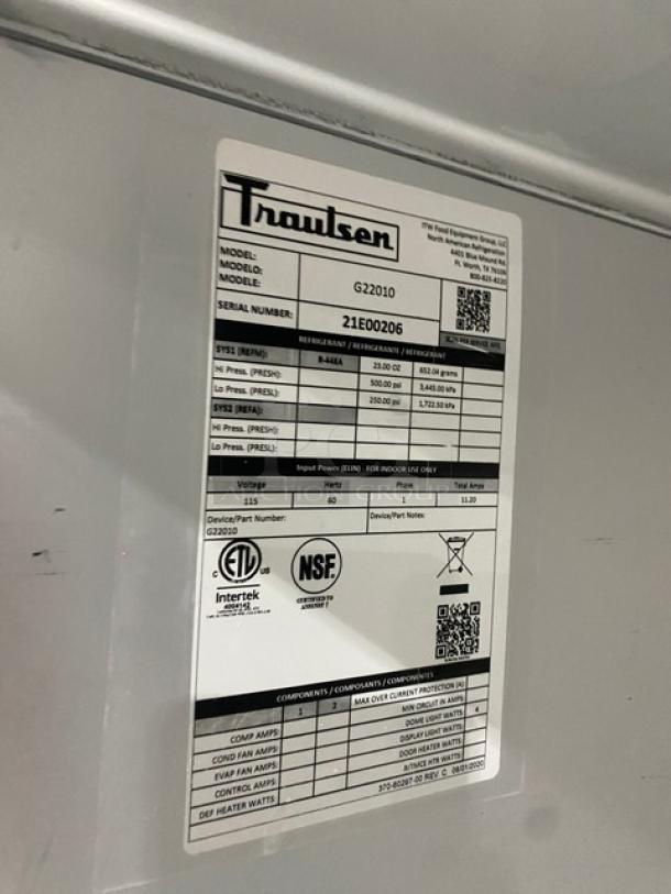 Traulsen G22010 commercial stainless steel, 2-door reach-in freezer label. Model: G22010. SN: 21E00206. NSF certified. On casters.