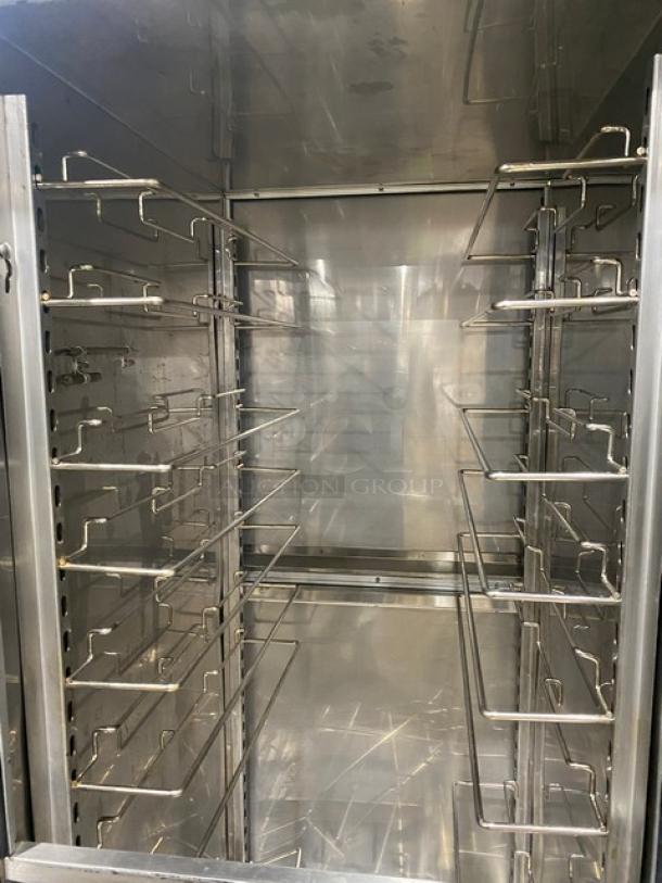 FWE MTU12PDD stainless steel heated holding cabinet, 12-pan capacity, pass-thru design with wired tray slides and humidifier.