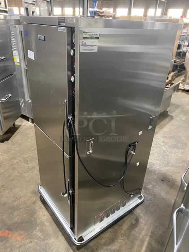 FWE MTU12PDD stainless steel 12-pan heated holding cabinet, features Dutch doors, moisture-temp humidifier, wired tray slides, and casters.