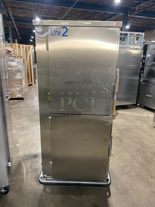 FWE MTU-12PDD commercial stainless steel heated holding cabinet with dutch doors and moisture-temp system on casters.