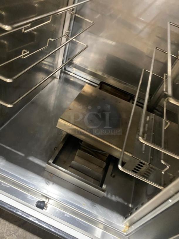 FWE MTU-12PDD stainless steel heated holding cabinet, 12-pan capacity, electric, with moisture-temp system, on casters.