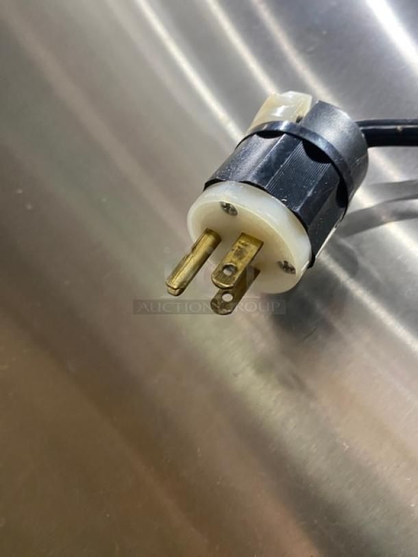 FWE MTU12PDD electric plug on stainless steel surface, showing 120V connector detail for the heated holding cabinet.