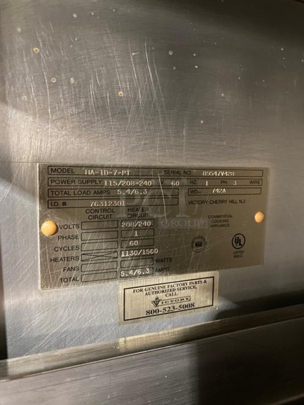 Victory stainless steel Dutch door pass-thru heated cabinet, model HA-1D-7-PT, with wide pan slides and visible labels.