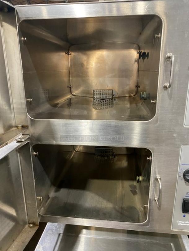 Cleveland Range 24CEM24 Classic Series stainless steel dual-compartment convection steamer on legs. Good condition. 208/220V 3 phase.