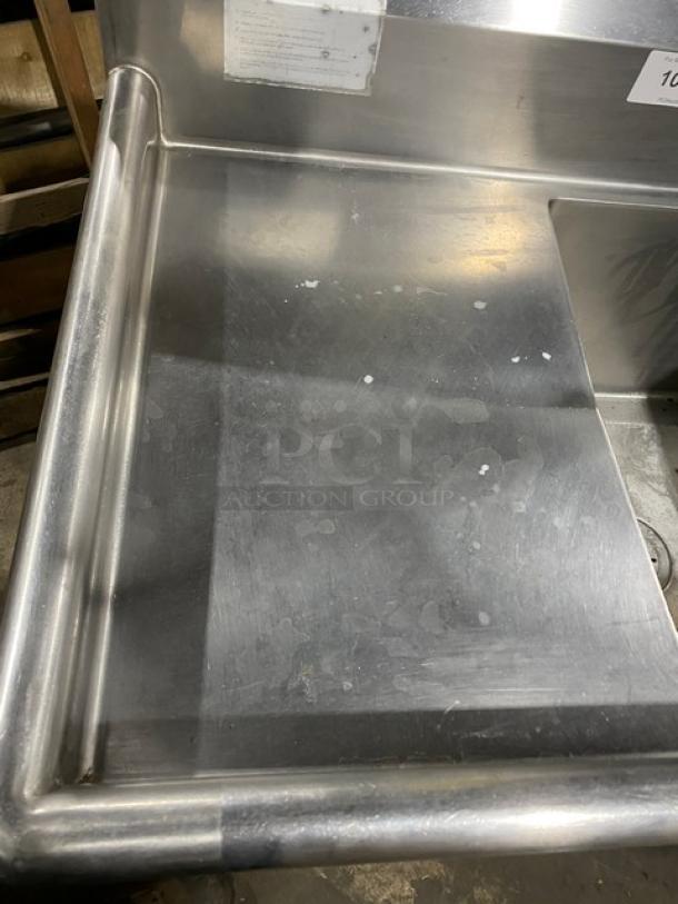 Duke Manufacturing commercial stainless steel 3-compartment sink with left/right drainboards, backsplash, faucet, on legs.