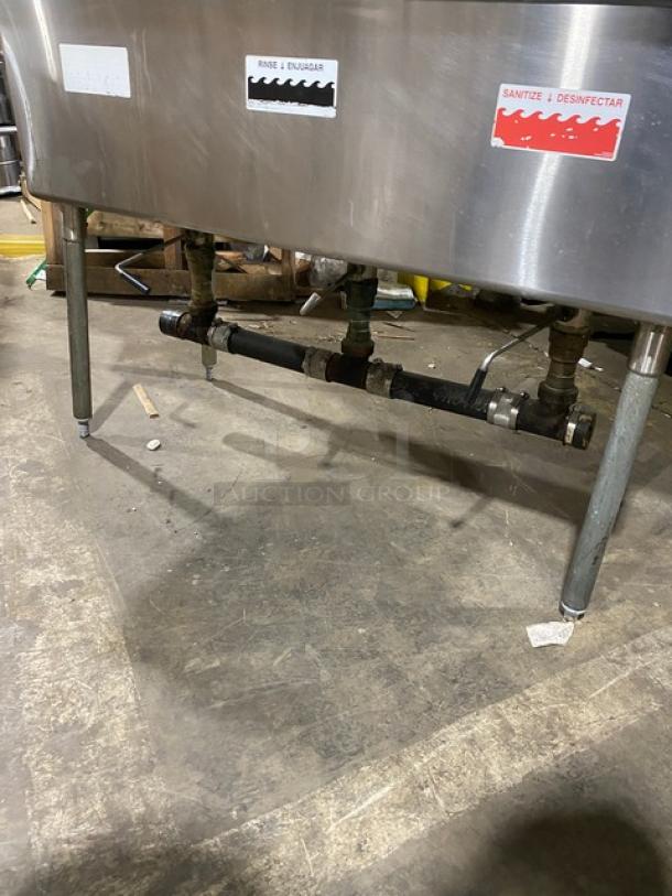 Duke Manufacturing stainless steel 3-compartment sink with drain boards, backsplash, swing spout, labels for use and sanitization.