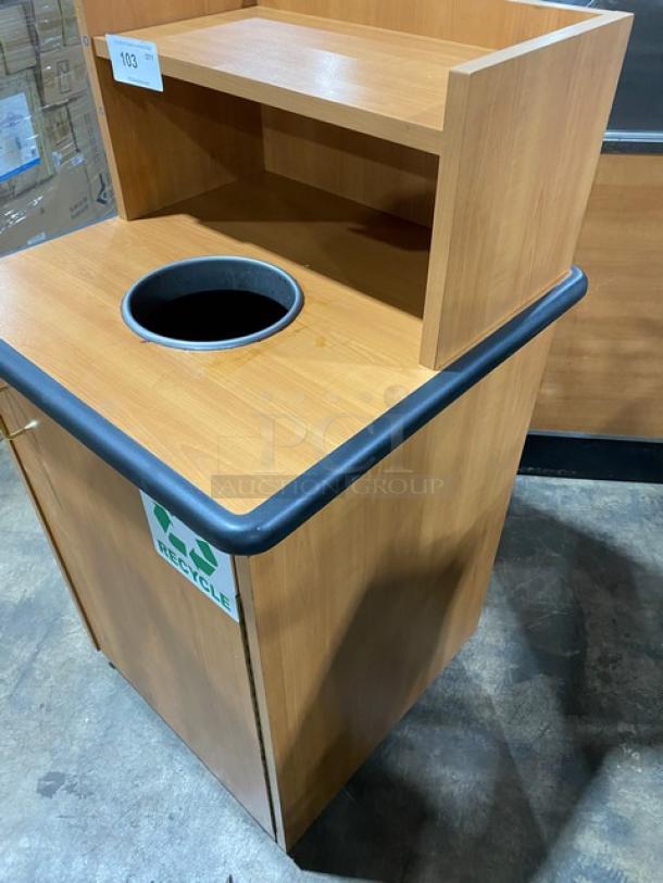 Commercial wooden enclosed recycle receptacle with upper tray storage, on legs, featuring a recycle label.