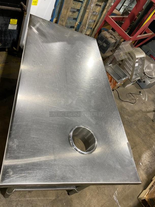 Duke Manufacturing stainless steel prep table, model DC-7202-6030, with undershelf, round waste chute, on sturdy legs.