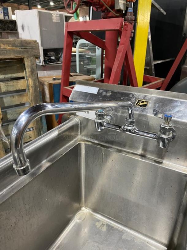 Duke Manufacturing stainless steel single compartment sink with backsplash, swing spout faucet, and legs; good condition.