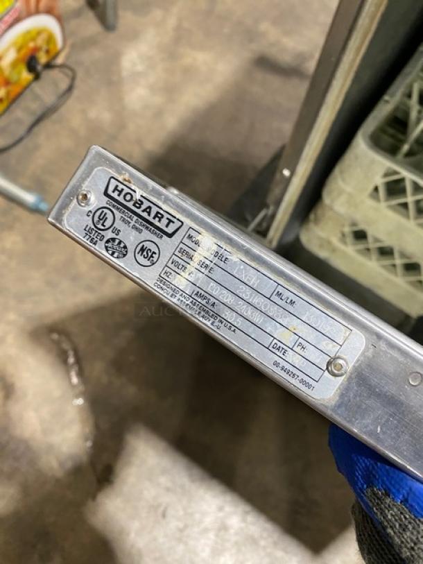 Hobart LXEH commercial dishwasher label showing model, serial number, voltage, and certifications. Stainless steel finish.