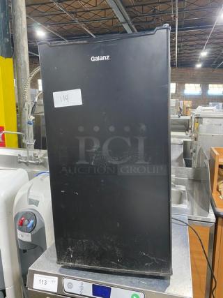 Galanz GLR33MBKE23 black single door mini refrigerator, commercial model, shows surface wear, 120V, SN: BX23110240115.