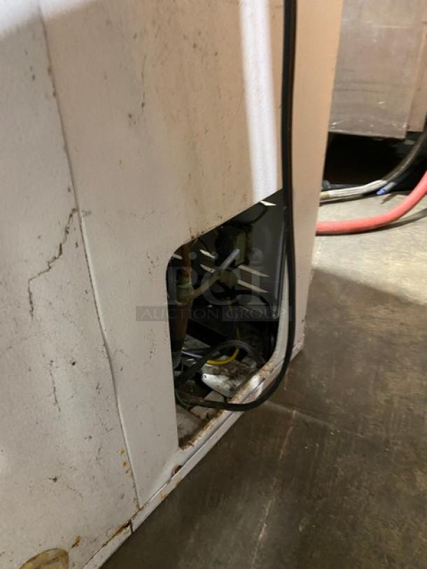 Kenmore Commercial White Chest Freezer, Model 253.9155110, 115V. Visible wiring and rear access panel. Some wear and marks present.