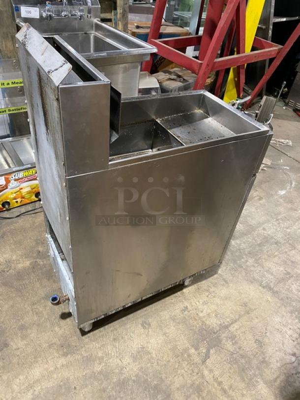 American Range stainless steel commercial deep fat fryer, natural gas powered, with back splash, basket hanger, and legs.