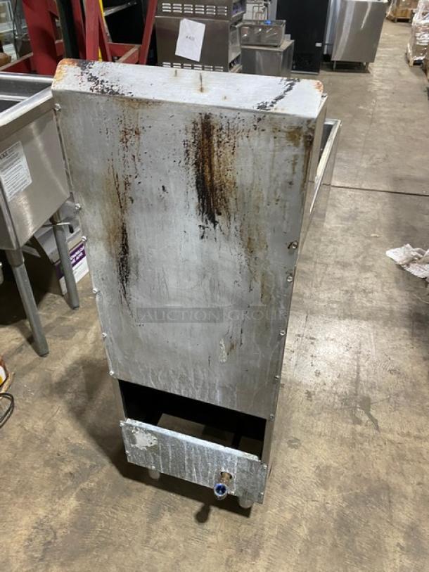 American Range commercial stainless steel deep fat fryer, natural gas powered, with back splash, basket hanger, on legs. Signs of use.