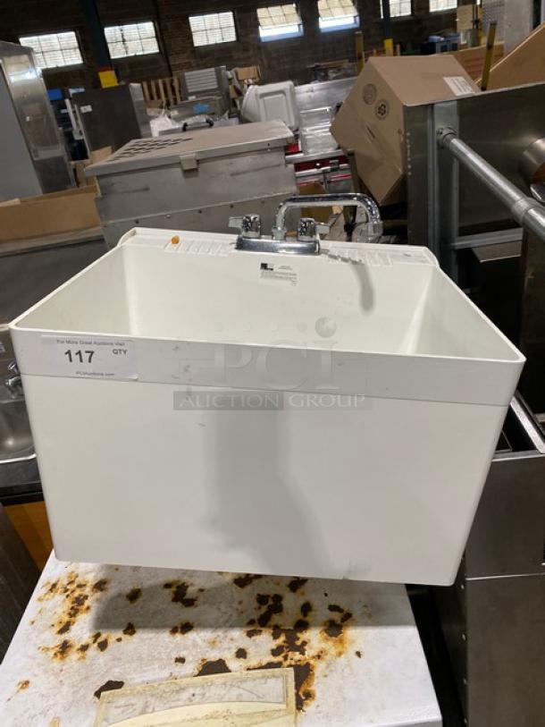 Commercial white single compartment mop service basin with swing spout faucet and legs, in good condition.