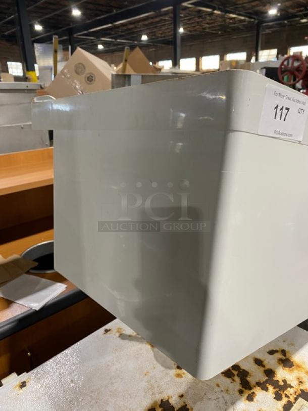 Commercial white single compartment mop basin with swing spout faucet, sturdy legs, and a visible auction tag.