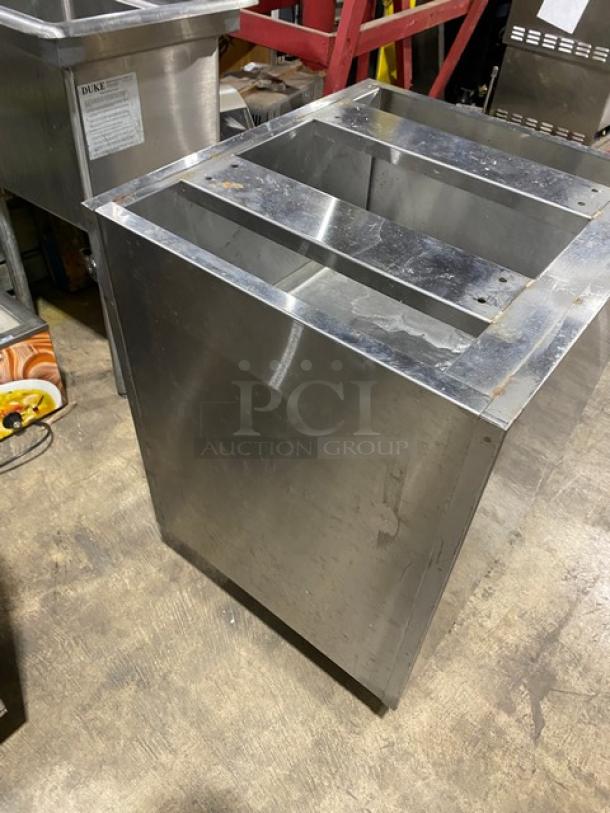 Custom stainless steel work cabinet with double interior pull-out shelves, enclosed style, on legs, commercial grade.