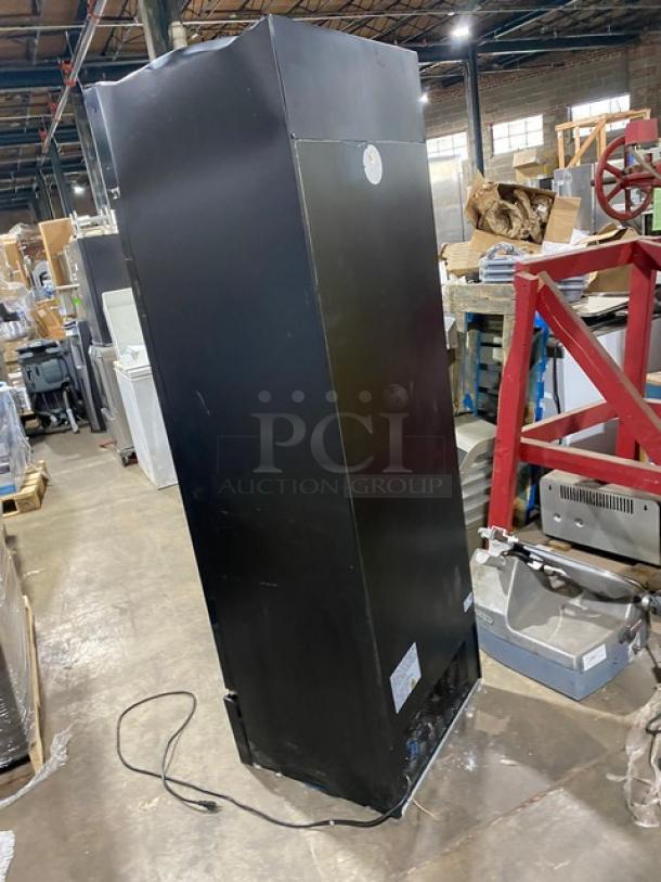 Avantco Model 178GDC15HCB single door refrigerator, black, LED lighting, poly coated rack, tags visible, used condition.