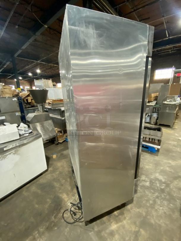 True T-35 commercial stainless steel 2-door reach-in refrigerator with wired rack, model SN: 8784235, on casters.