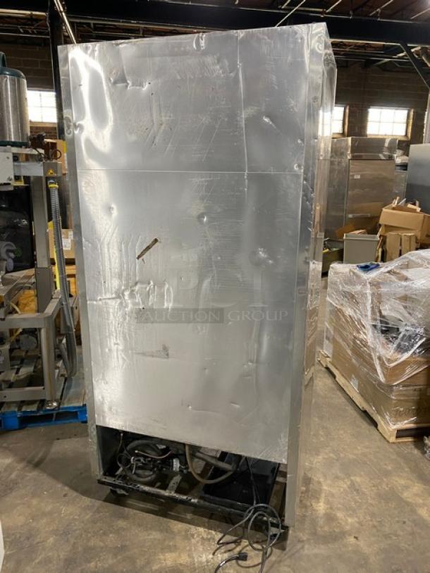 True Commercial Stainless Steel 2-Door Reach-In Refrigerator, Model T-35, on casters, with wired rack, 115V 1 Phase.