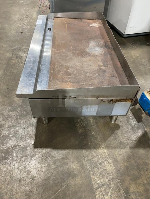 Cook Rite commercial stainless steel gas griddle with back and side splash, on legs, used condition.