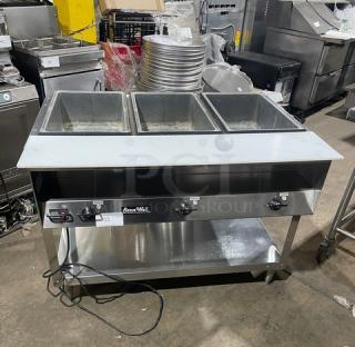 Vollrath Serve Well Series 3-well hot food/steam table, model 38003, with cutting board, undershelf, 120V, stainless steel.