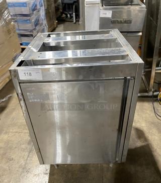 Stainless steel enclosed work cabinet with double pull-out shelves, on legs, includes wear marks, label shows "118 QTY."