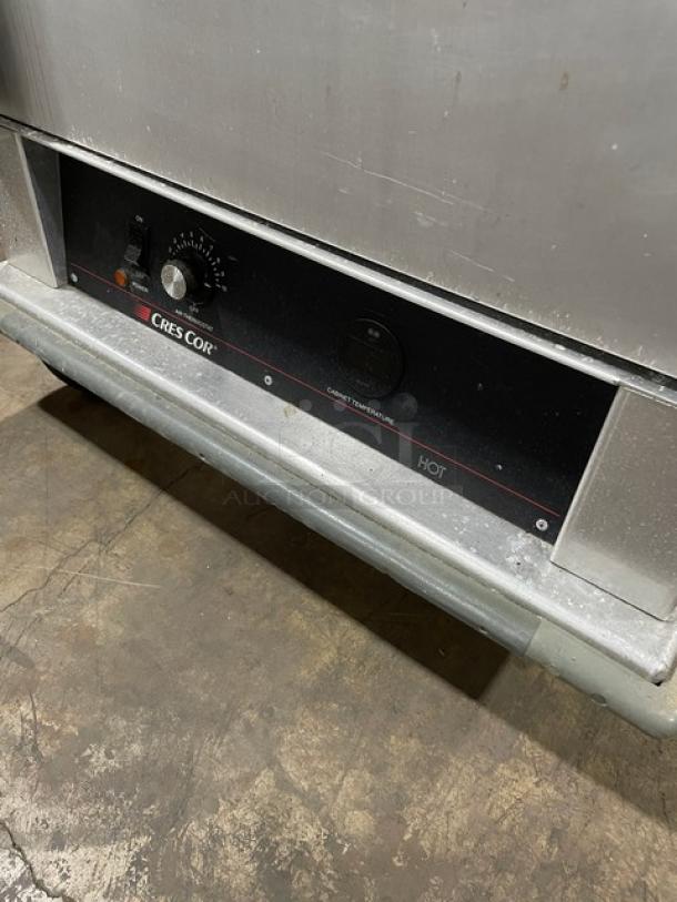 Cres-Cor stainless steel heated holding cabinet with solid Dutch doors, wide pan slides, rubber bumper guard, and casters.