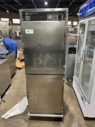 Henny Penny HC900 stainless steel heated holding cabinet, half door, single section, on casters, 120V, with pan slides.