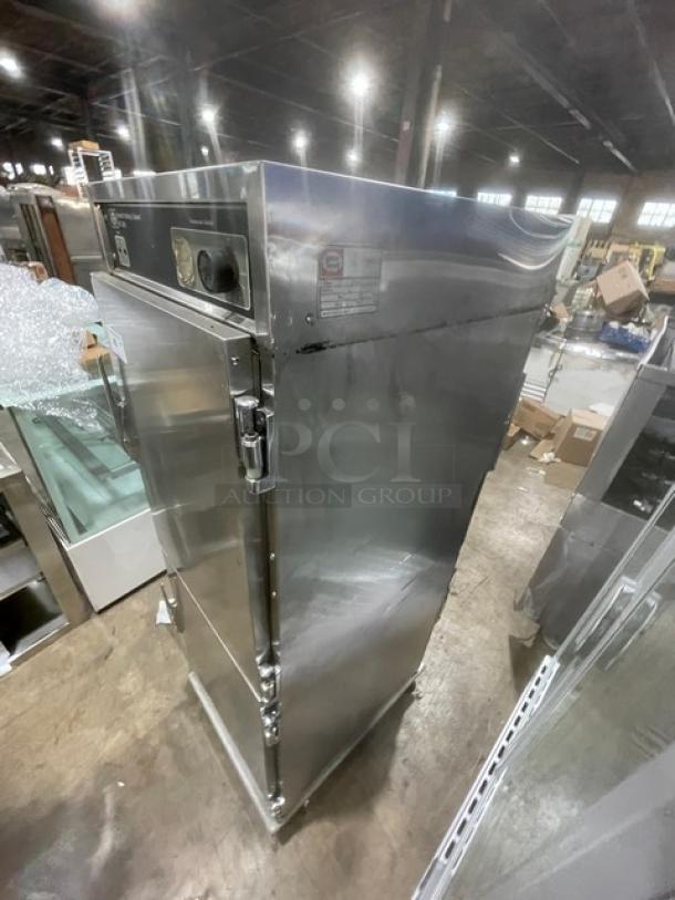 Henny Penny HC-900 commercial stainless steel heated holding cabinet, half door, insulated, built-in pan slides, on casters.