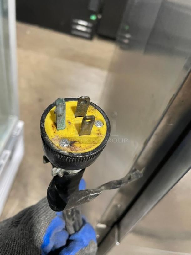 Henny Penny HC-900 stainless steel heated cabinet plug detail, showing yellow three-prong plug, 120V, single phase.