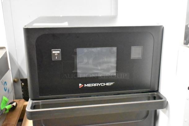 Merrychef eikon e1s high-speed countertop oven, brand new, with minor scratches. Black finish, 208/240V, single phase.